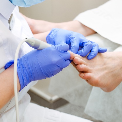 close-up of person receiving a foot care treatment